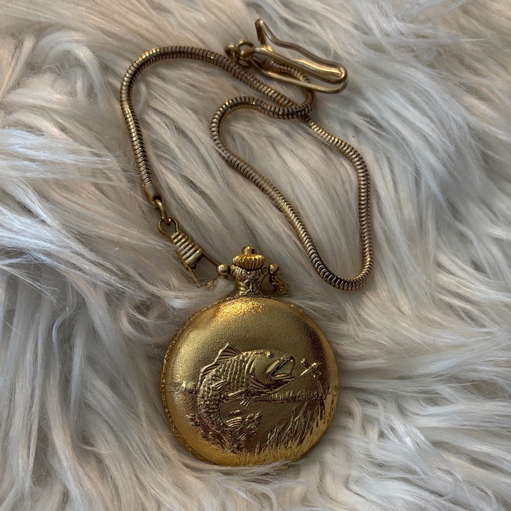 Gold Pocket Watch with Fish Motif does not run
